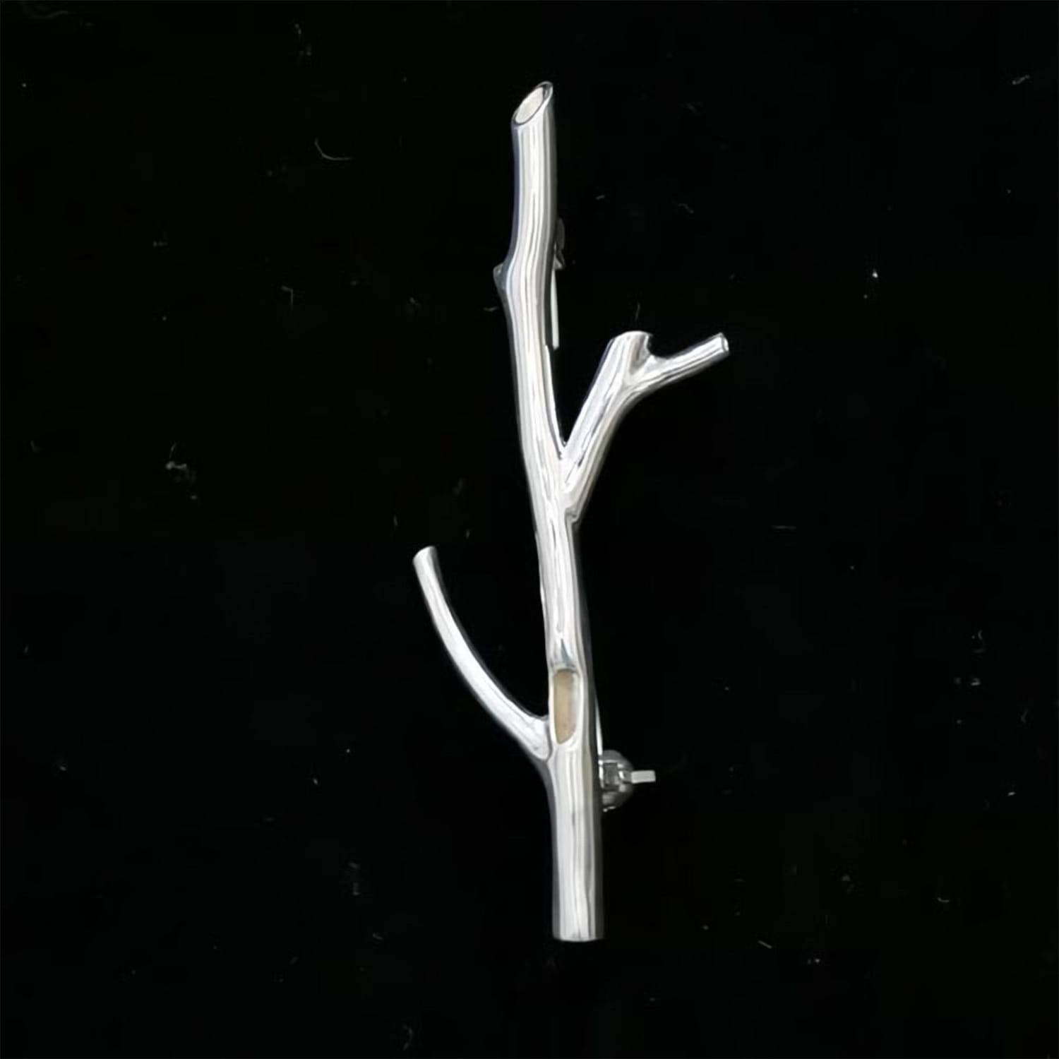 Silver tree branch brooch pin with a polished metallic finish and intricate silver branching design for fashion corsage.