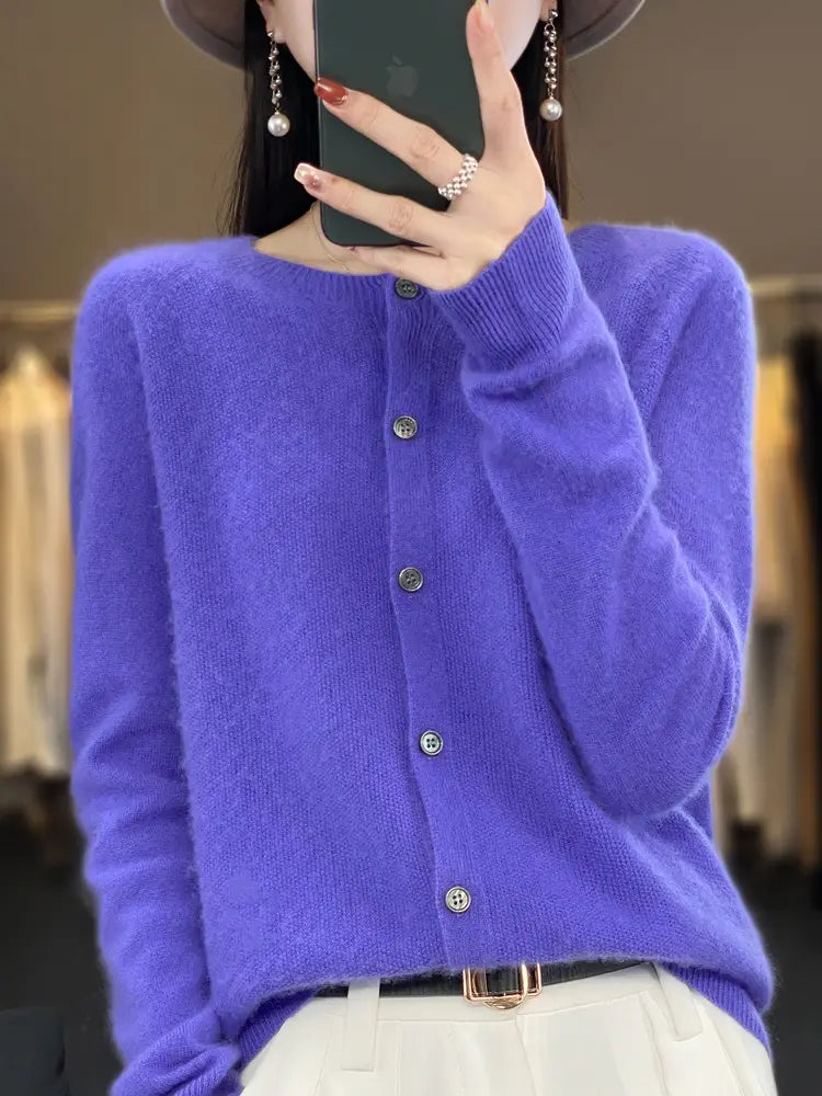 A soft vibrant purple merino wool cardigan for women featuring cashmere knit fabric silver buttons and a round neckline.