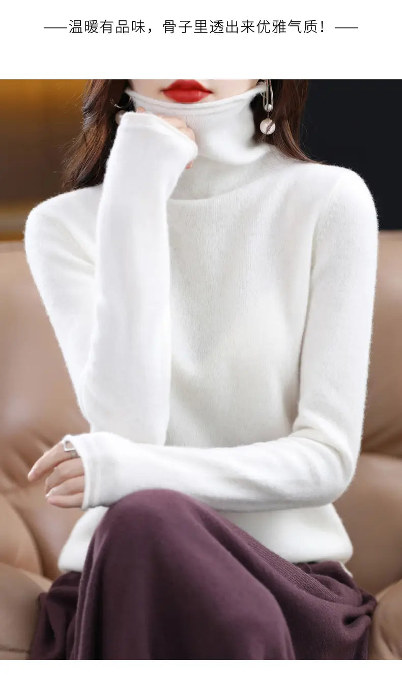 White merino wool turtleneck sweater for women with a soft ribbed texture and long sleeves.