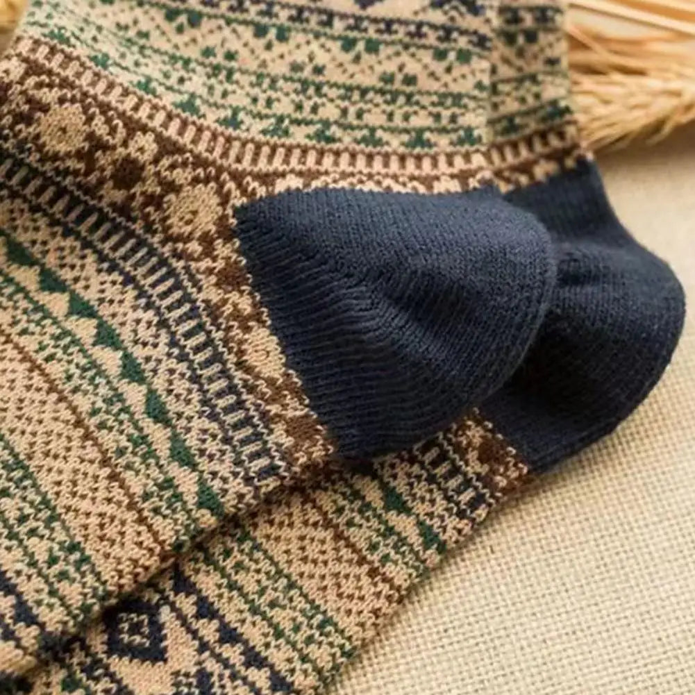 A pair of men retro cotton crew socks with mid-high tube design featuring cozy earthy knitted geometric patterns in beige brown and green for a fashion trend.