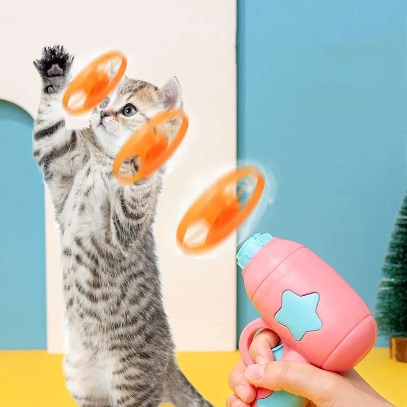 星形のデザインを備えた、ピンク色と青色のプラスチック製インタラクティブ飛行ディスクの猫用おもちゃの銃(ペット向けの娯楽用)。