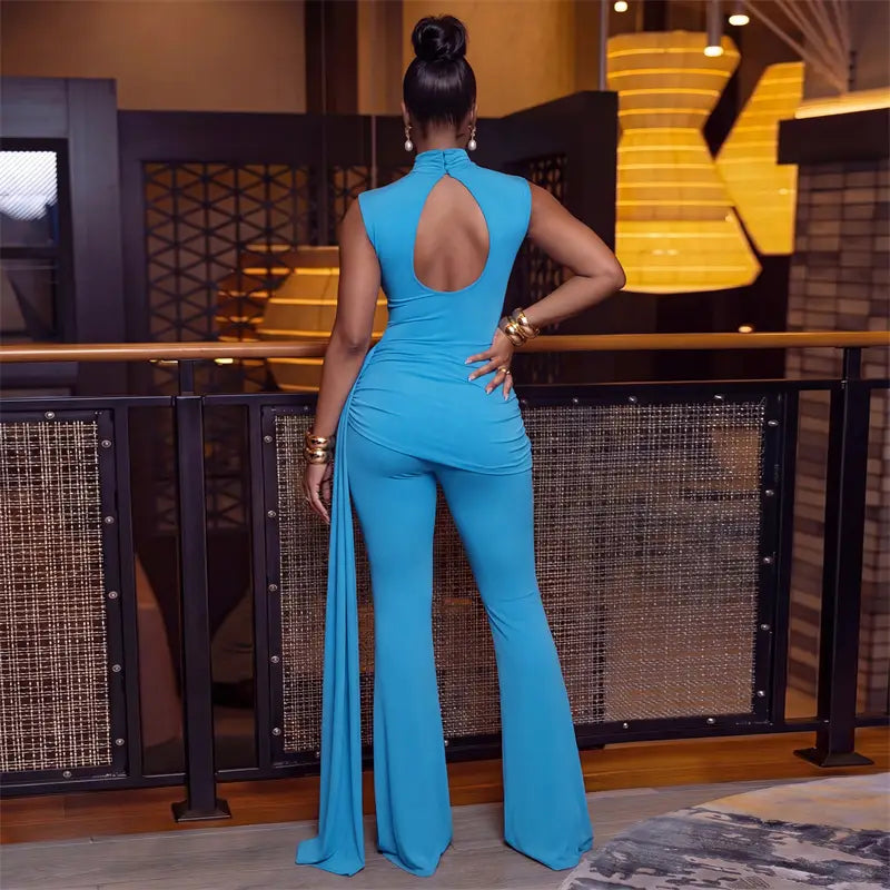 A vibrant turquoise sleeveless piece sets woman jumpsuit featuring a ruched high neck, open back design, flared legs, and back button closure type.