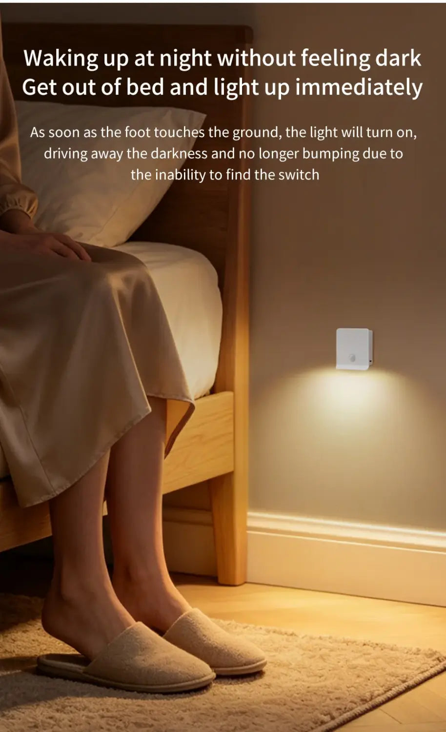 A sleek white wall-mounted motion sensor night light with a minimalist design emits a warm glow to illuminate the floor upon touch, featuring a rechargeable LED cabinet lamp.
