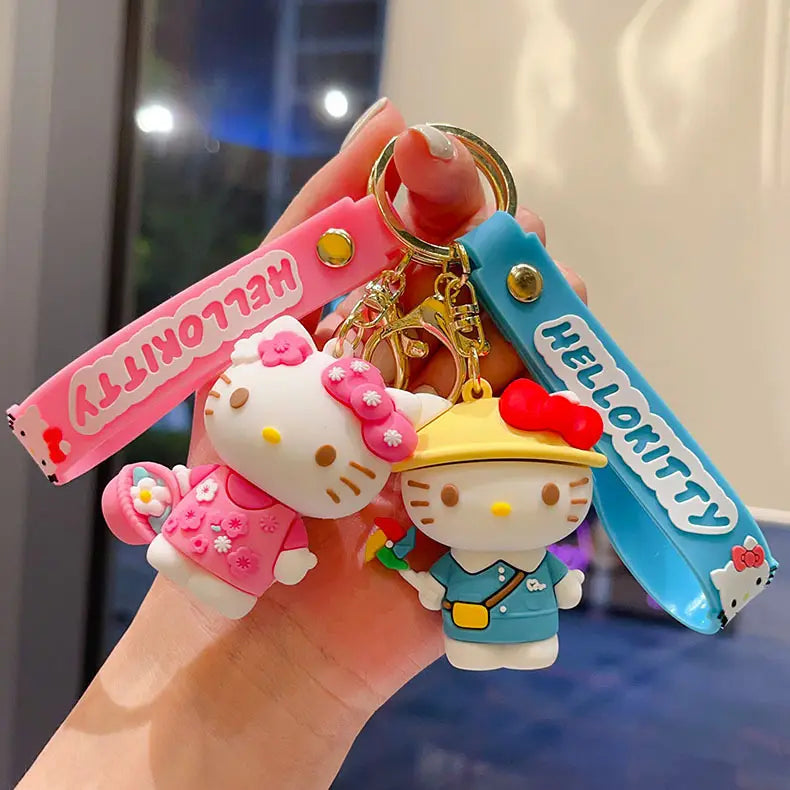 hello kitty cartoon keychain anime bag charm set featuring two soft silicone figurines in pink and blue with matching color-themed straps.