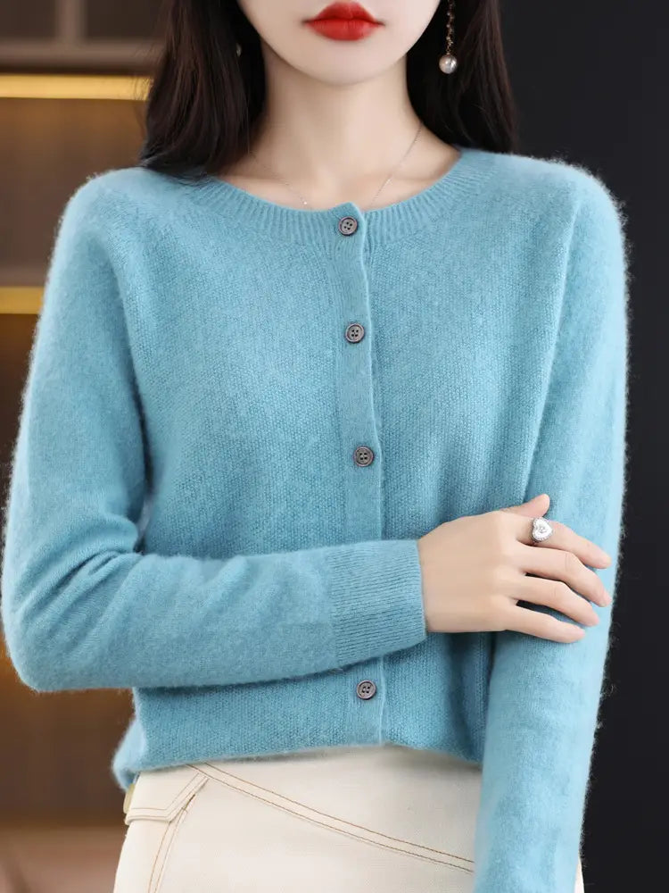 A soft light blue cashmere knit cardigan for women with a round neckline and button closure from the Merino wool collection.