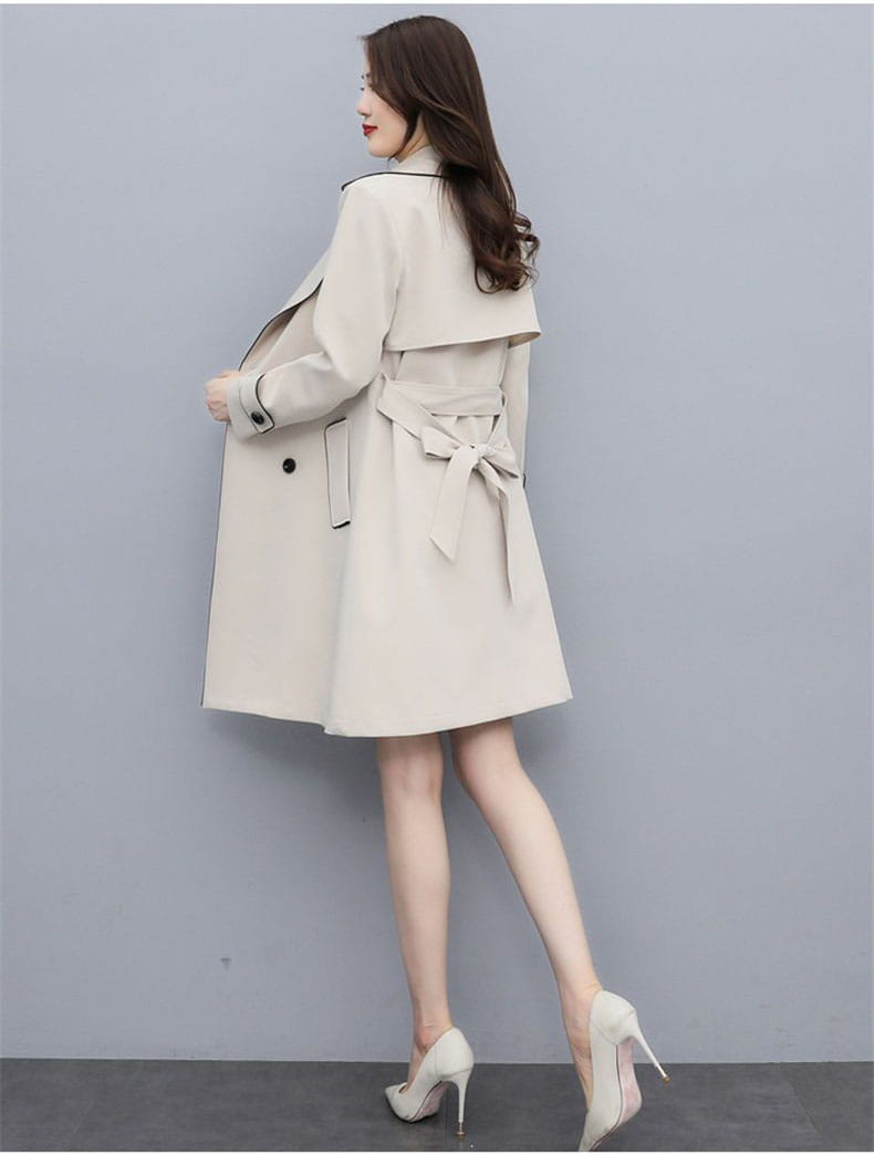 beige women double breasted trench coat with a belted waist and tailored front ideal for stylish outerwear.