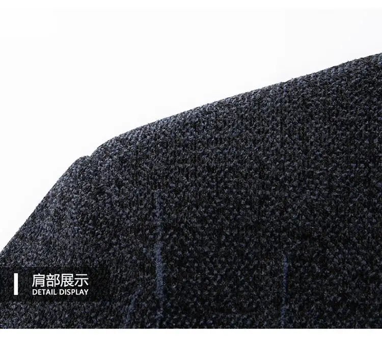 dark gray textured fabric shoulder detail of a men wool blend winter trench coat highlighting its material and design.