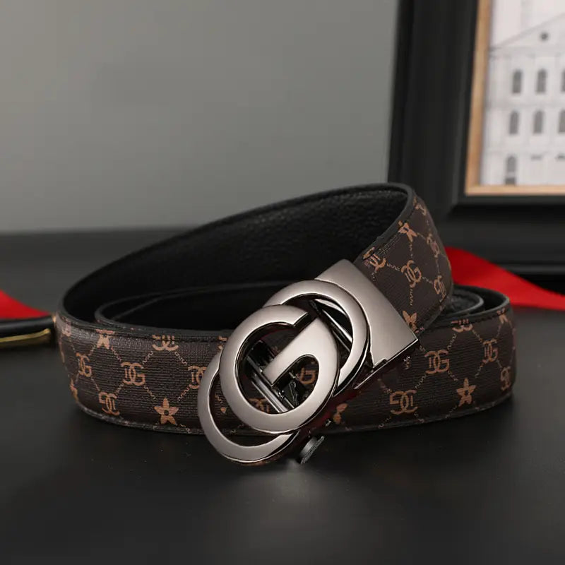Men leather automatic buckle belt in brown leather with a repeating gold-toned monogram and star pattern and a sleek silver-tone double g buckle.