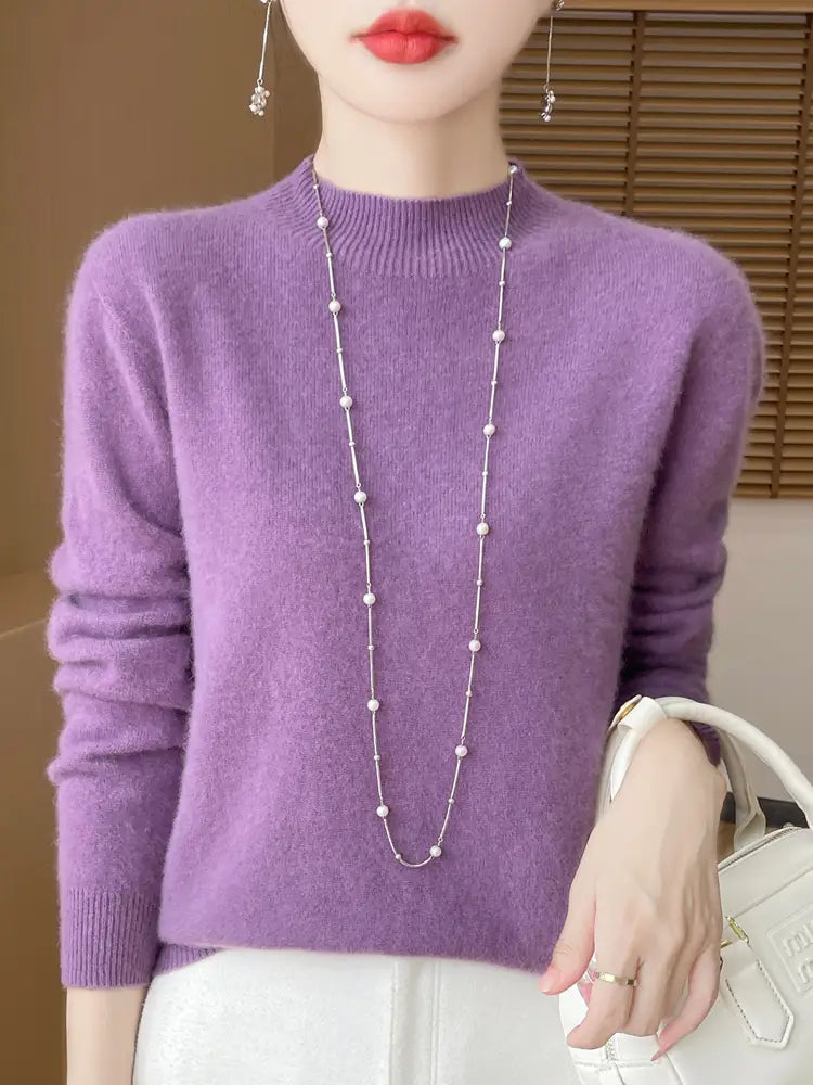 A soft lavender merino wool pullover sweater for women with a ribbed crew neckline and cuffs.