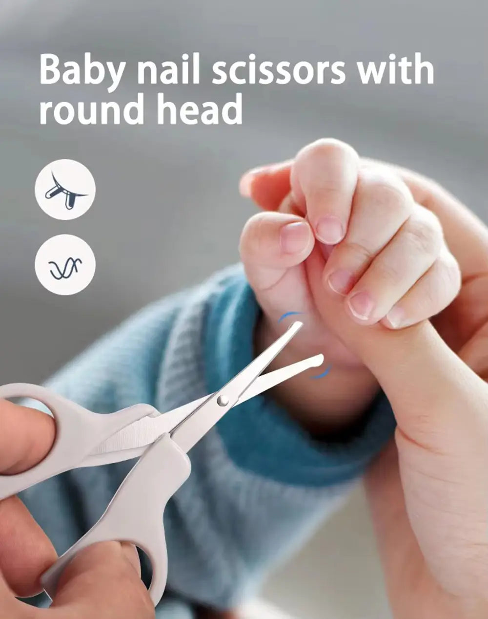 Baby-Nagelschere mit rundem Kopf, mit weichen weißen Kunststoffgriffen und Klingen aus Edelstahl für die Neugeborenenpflege in einem Baby-Pflege-Set.