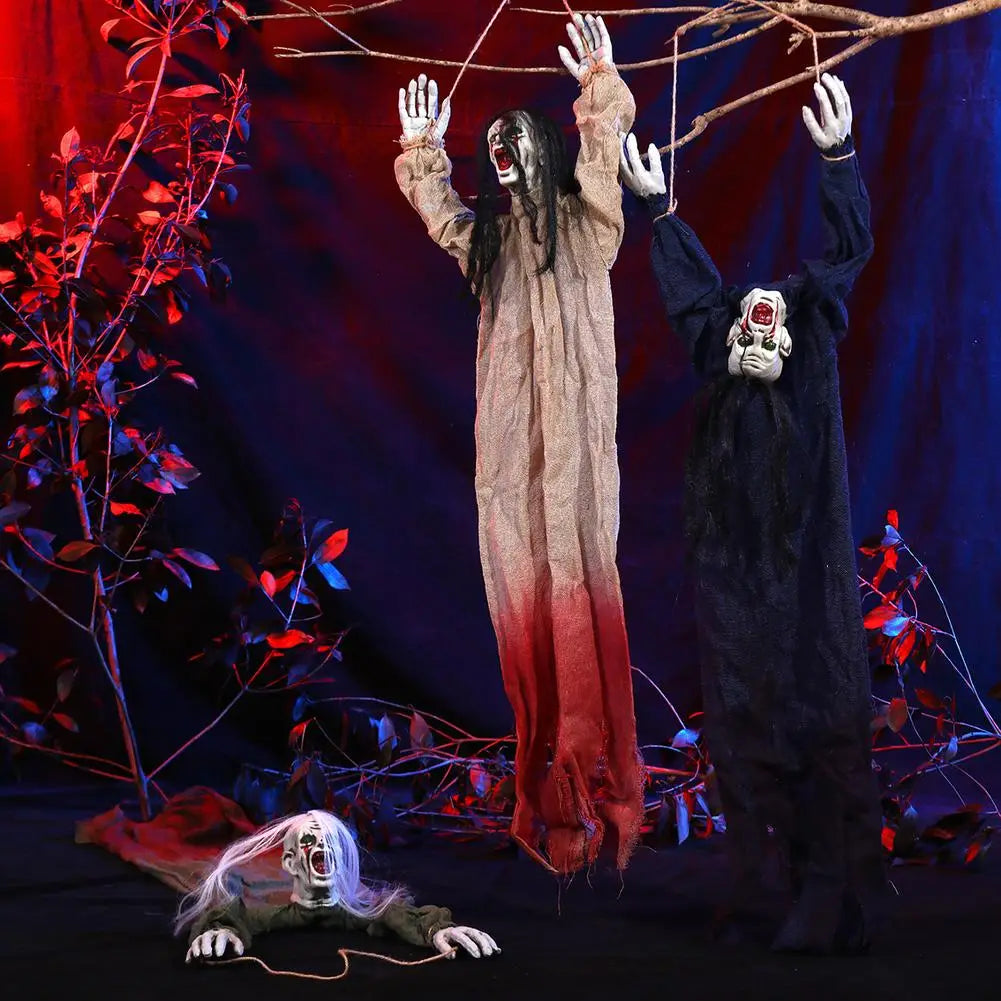 two hanging halloween decorations of creepy scarecrow props featuring one figure in a beige and red gradient tattered robe with long black hair and another in a solid black robe with a white face mask and glowing eyes.