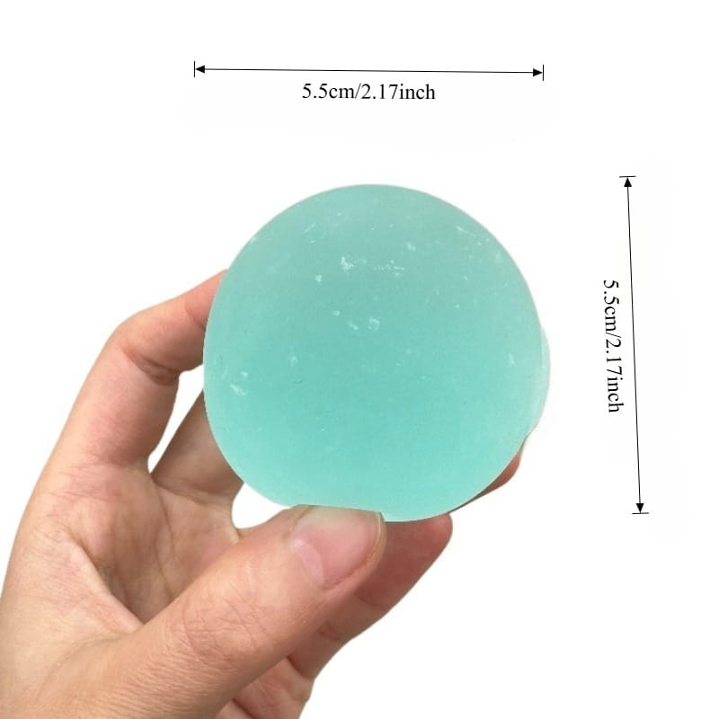 a translucent light blue spherical stress ball with a smooth slightly textured surface designed as a blue mochi squeeze sensory fidget toy