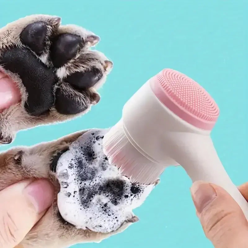 pink and white electric pet paw cleaner with soft silicone bristles gently cleaning a dog paw