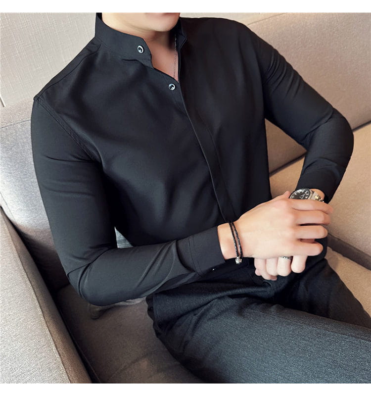 Black long-sleeved men dress shirt with slim fit stand collar and subtle button details designed for a formal look and correct size fit.