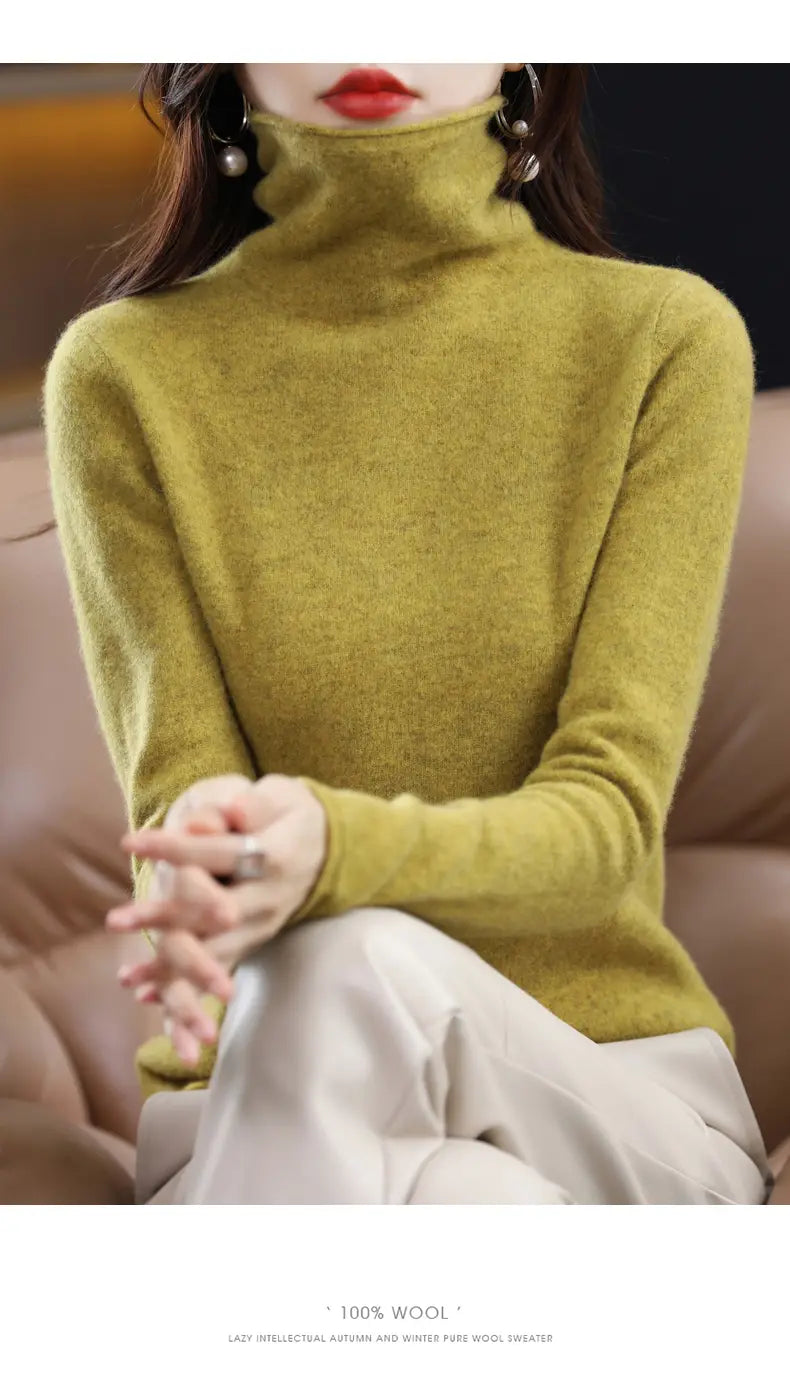 A soft olive green merino wool turtleneck sweater for women made of 100 percent wool with a smooth slightly textured knit.