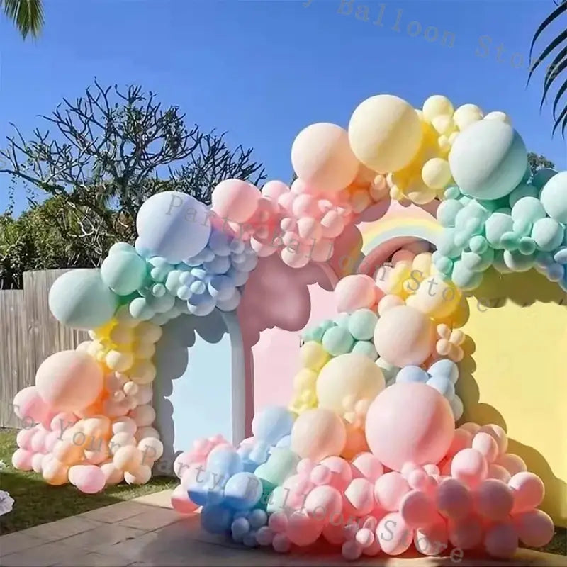 pastel rainbow balloon arch kit featuring soft pastel-colored latex balloons in shades of pink blue yellow and mint green for wedding and birthday parties.