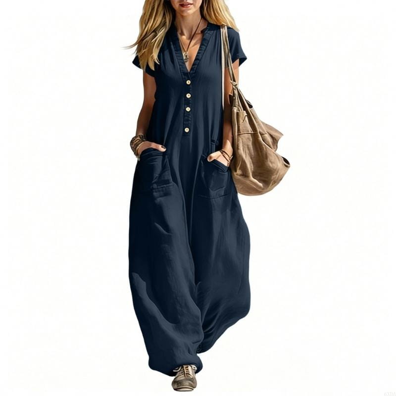 Navy blue short-sleeved women wide leg jumpsuit with button front and pockets made from lightweight fabric for casual wear.