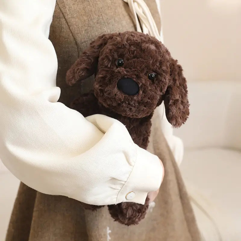 A plush stuffed animal toy 25cm featuring a soft brown curly fur puppy with black button eyes.