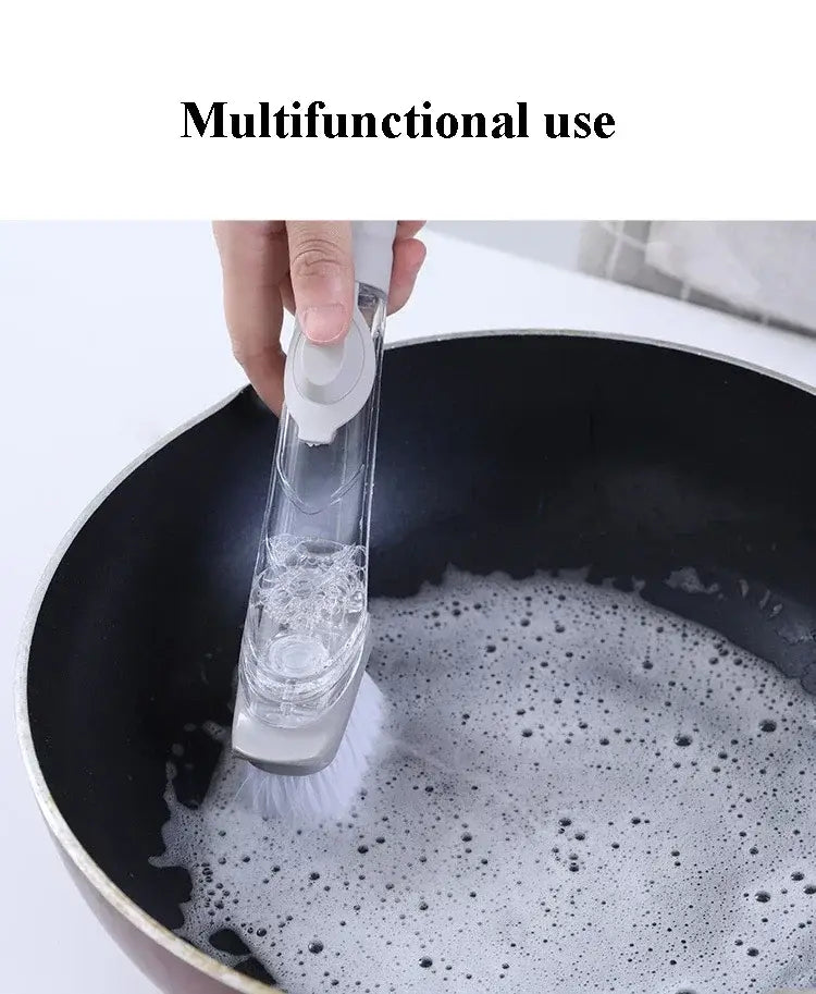 Brosse à vaisselle pour distribution de savon en plastique transparent avec long manche blanc et des brins multifonctions pour un lavage efficace de la vaisselle.