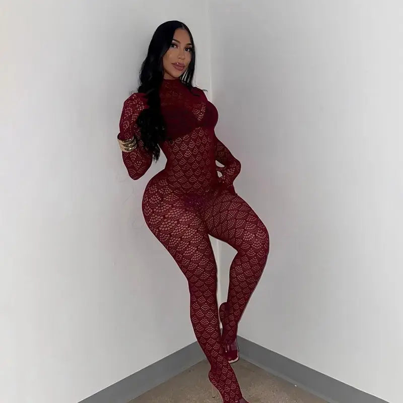 A form-fitting deep red lace fishnet see through long romper with a high neckline and long sleeves.