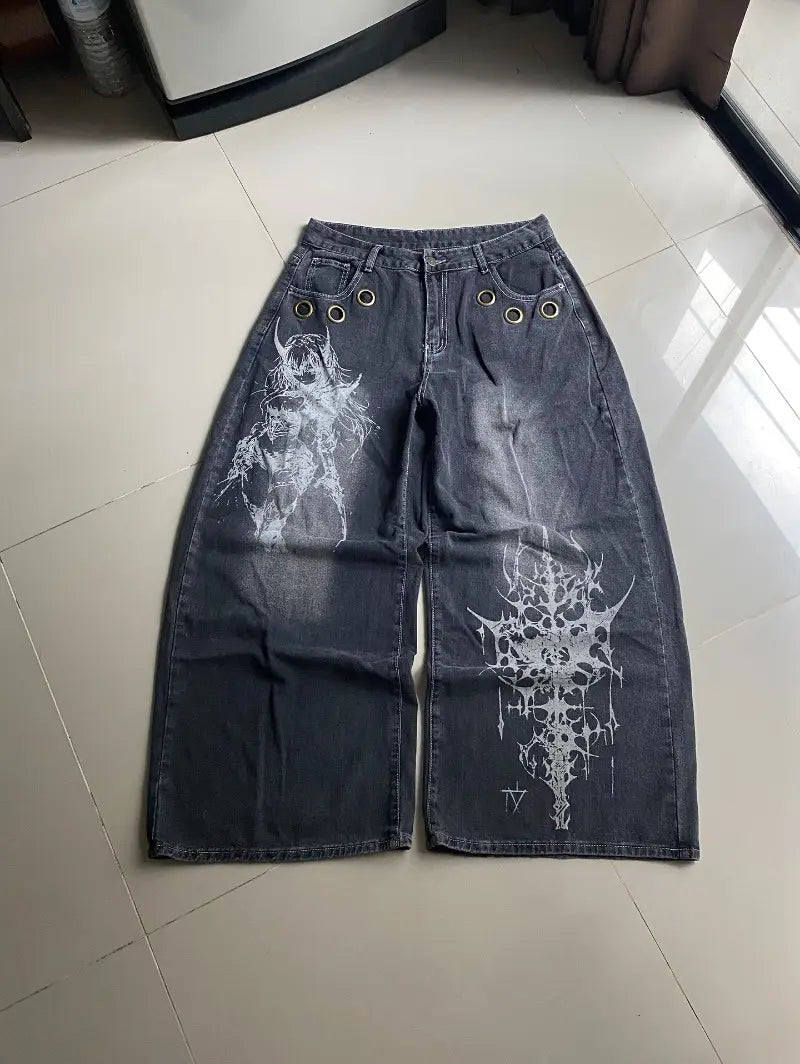 Dark wash denim wide-leg pants for men featuring white gothic-style graphic prints of a horned figure and spiked skull design, part of the Y2k Gothic Graphic Wide Leg Jeans collection.