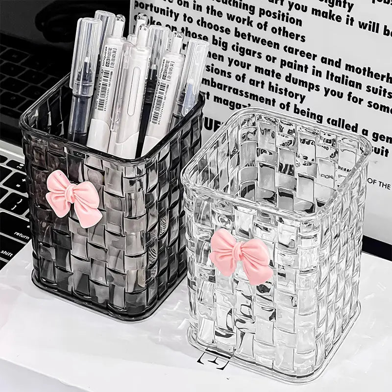 bow pen holder desktop storage organizer featuring clear and black woven plastic design each adorned with a pink bow for elegant desk organization
