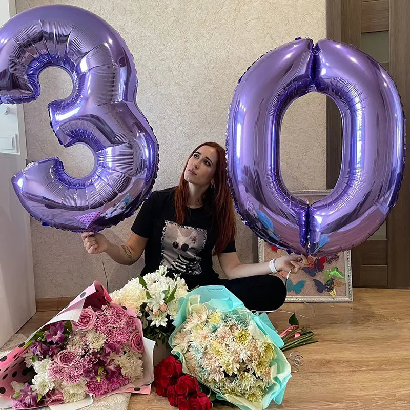 A 32 inch purple metallic foil balloon shaped as the number 30 designed for birthday parties.