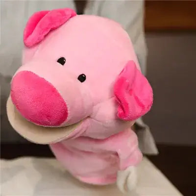 pink plush pig hand finger puppet made of soft fabric with embroidered black eyes as an educational baby toy from the lion elephant bunny collection