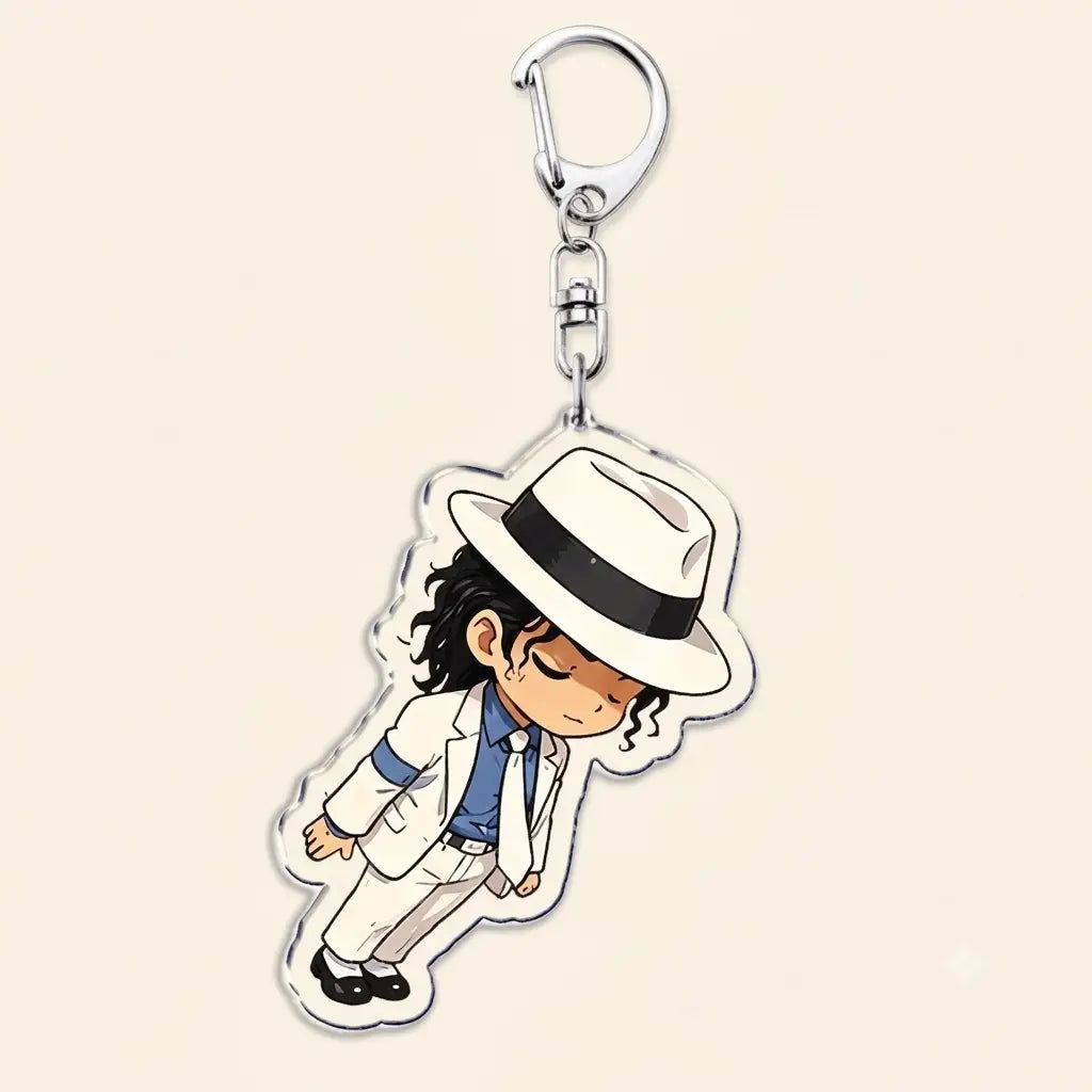 A clear acrylic keychain featuring a chibi-style illustration of Michael Jackson in his iconic white suit, blue shirt, and black-and-white fedora.
