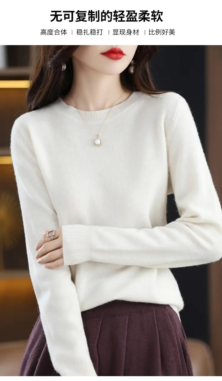 A soft off-white pure wool cashmere o-neck pullover sweater with a round neckline and ribbed cuffs.