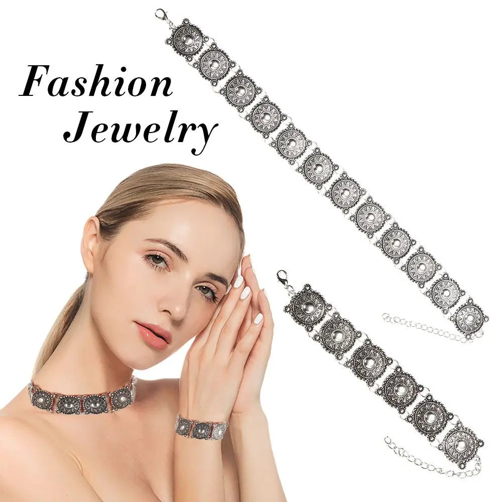 Boho silver vintage jewelry set featuring a silver-toned ornate choker and bracelet with intricate circular medallions and detailed filigree patterns.