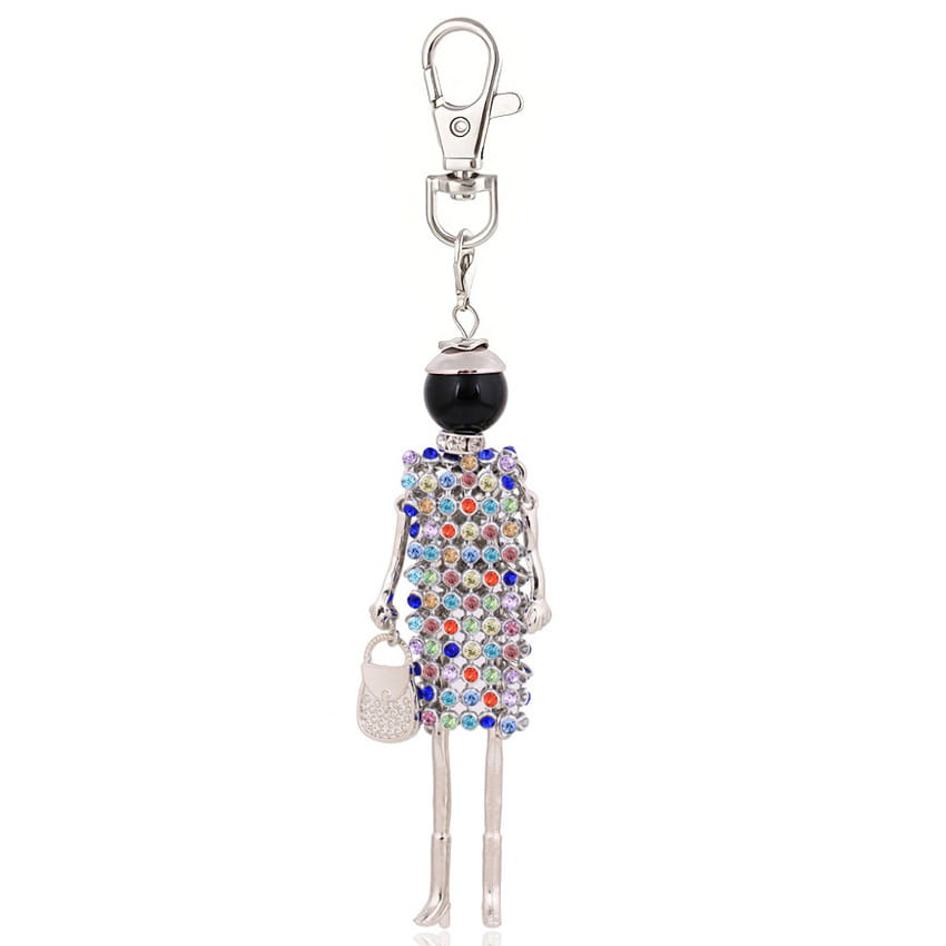 A silver-toned rhinestone doll keychain featuring a miniature figure with a black spherical head, adorned with multicolored rhinestones and holding a small jeweled purse, designed as a women bag pendant.