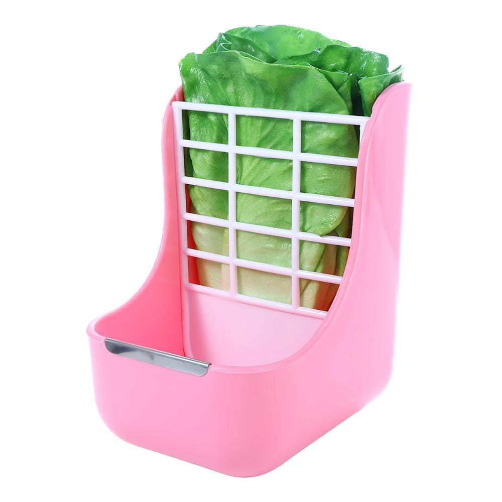 pink plastic rabbit hay feeder with white grid insert holding green lettuce for small animals use