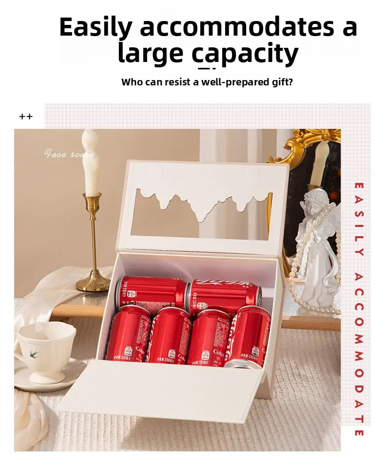 White gift box with decorative cutout lid containing six red Coca-Cola cans for European style wedding gift box candy packaging.