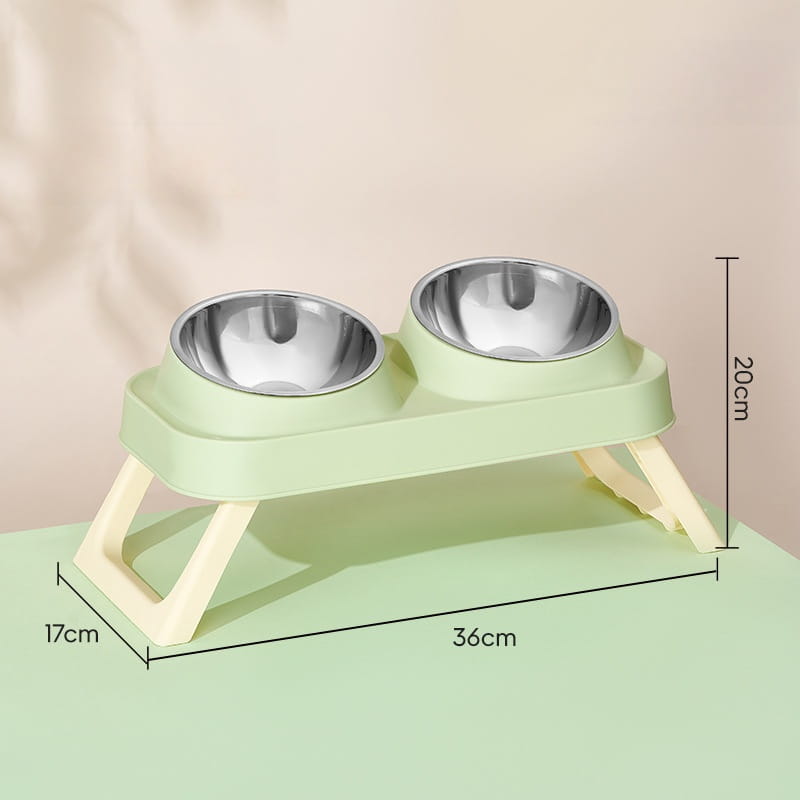 Elevated stainless steel pet feeder with tilt bowls featuring a light green plastic frame and two stainless steel bowls for feeding pets.