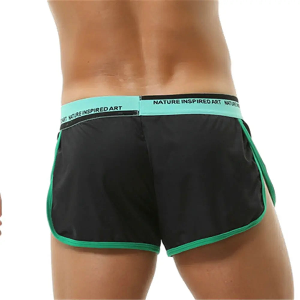 Boxer briefs para hombre transpirables, atléticos y de dormir, de color negro, con ribete turquesa y una pretina a juego que incluye arte inspirado en la naturaleza con letras blancas.