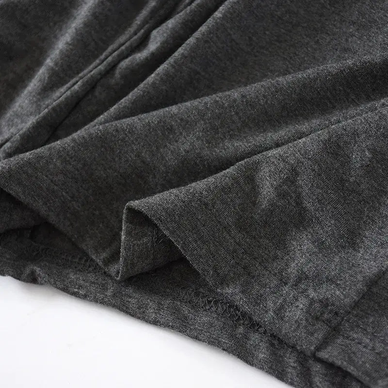 Stoff für Herren-Modal-Cotton-Loungewear-Shorts in dunkelgrau melierter Baumwolle mit weicher, strukturierter Webart und sauber vernähtem Saum