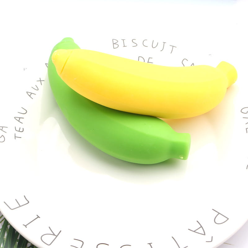 yellow and green silicone banana-shaped slow rising stress relief toys shown from a front angle