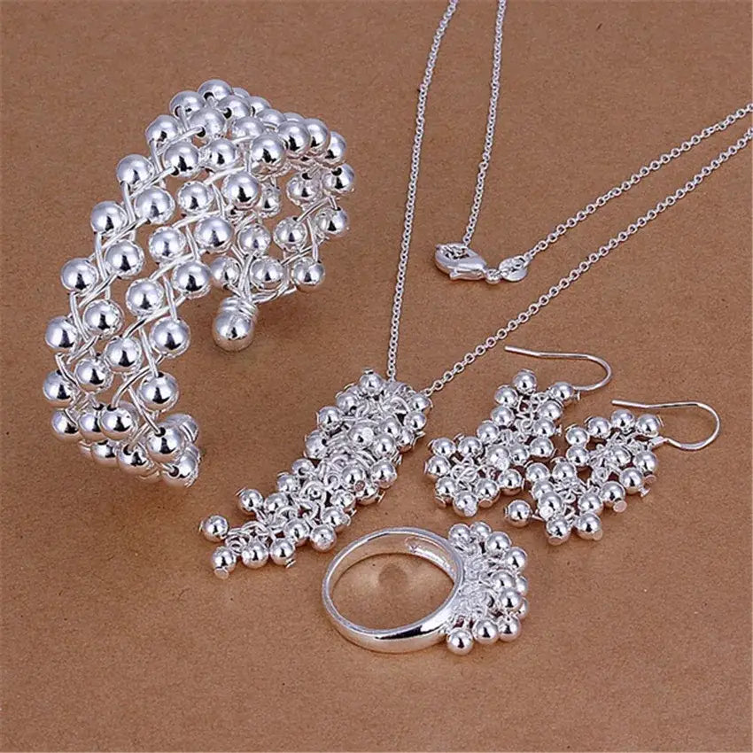 Silver grape bead jewelry set featuring a bracelet necklace earrings and ring made of 925 silver with intricate ballwork design.
