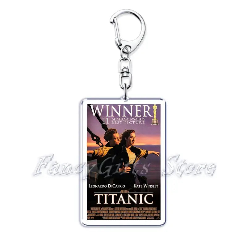 Silver rectangular acrylic keychain featuring a printed Titanic movie poster with Leonardo DiCaprio and Kate Winslet against a sunset backdrop from the movie poster acrylic keychain set.