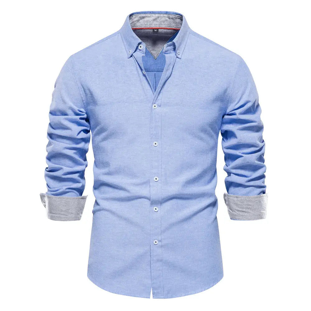light blue long-sleeved dress shirt with contrasting gray cuffs and collar lining designed as a fashion social shirt for men.