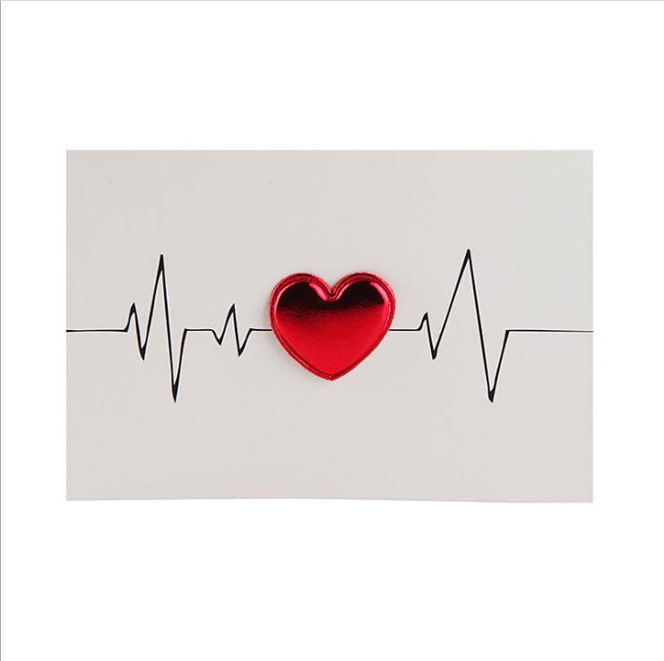 A glossy red heart-shaped object centered on a black electrocardiogram line featured on red heart valentine greeting cards and wedding invitations.