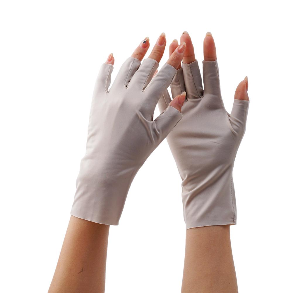 Light gray fingerless UV protection sunscreen driving gloves made of smooth stretchy fabric shown from the back side.