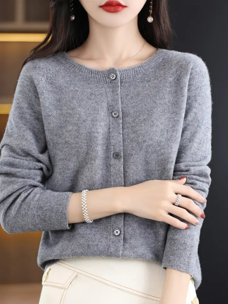 Gray merino wool cardigan women cashmere knit sweater with a round neckline and button closure.