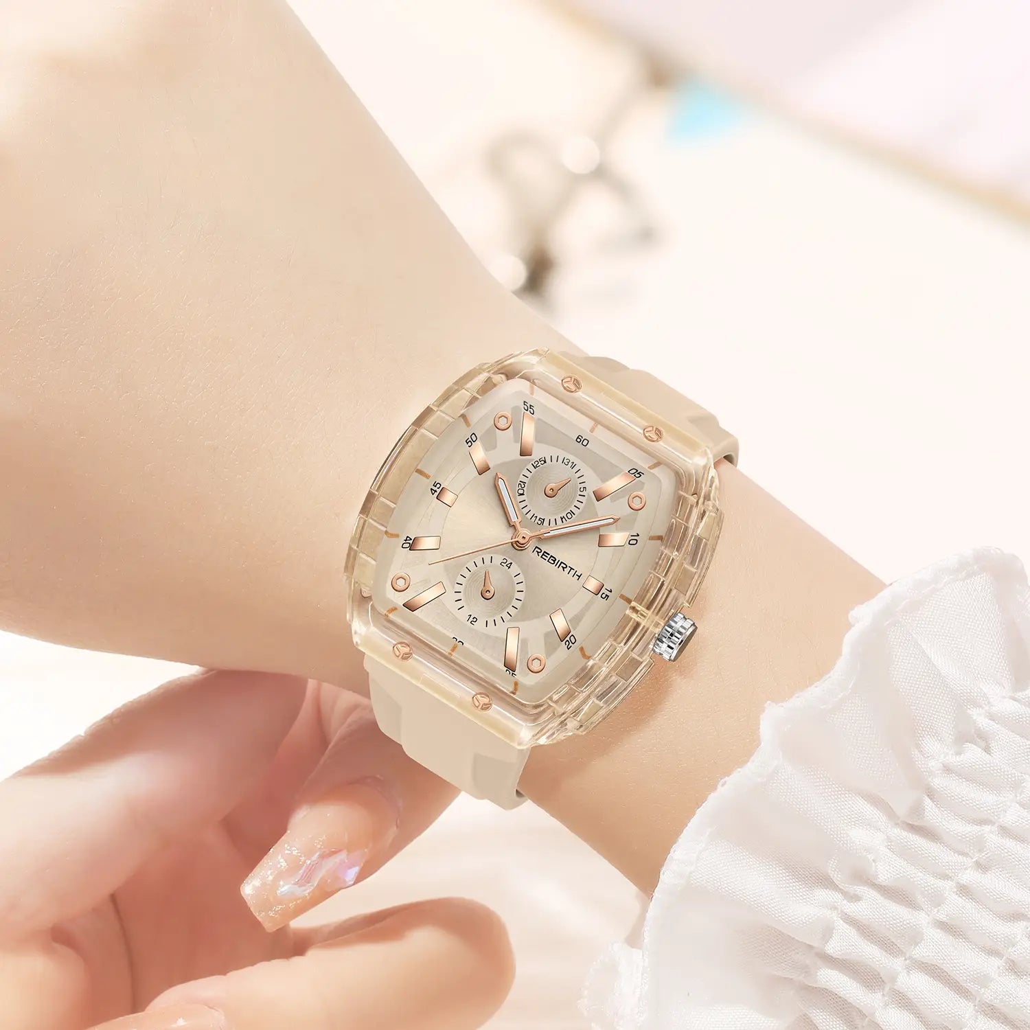 silicone casual watch with a transparent rose gold accented square dial featuring a white dial with multiple subdials.