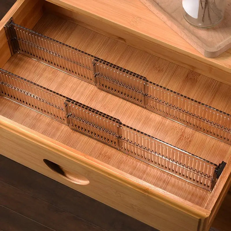 clear plastic drawer partition adjustable storage divider with sleek ribbed design and black metal ends for organizing drawers