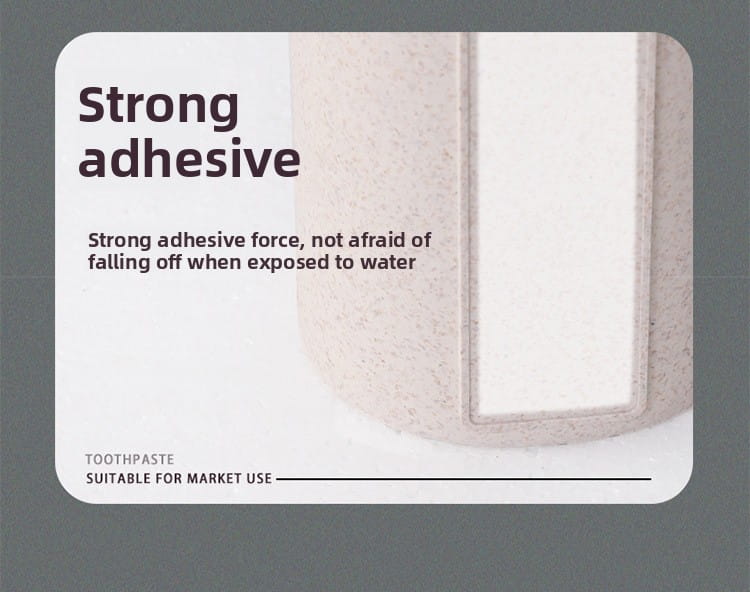 a beige textured toothpaste tube with a white rectangular label in a wall mounted toothpaste dispenser and holder set