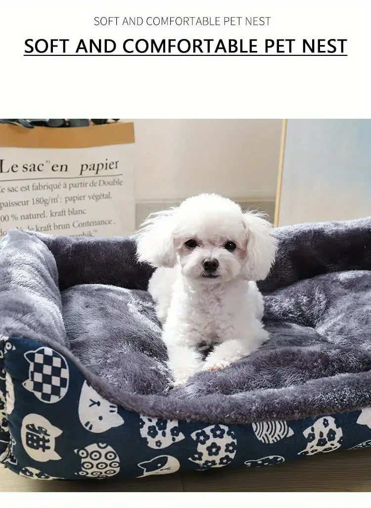 A cozy navy blue pet nest cat bed with a plush soft gray interior and playful white cartoon animal patterns on the exterior designed for winter pet products.