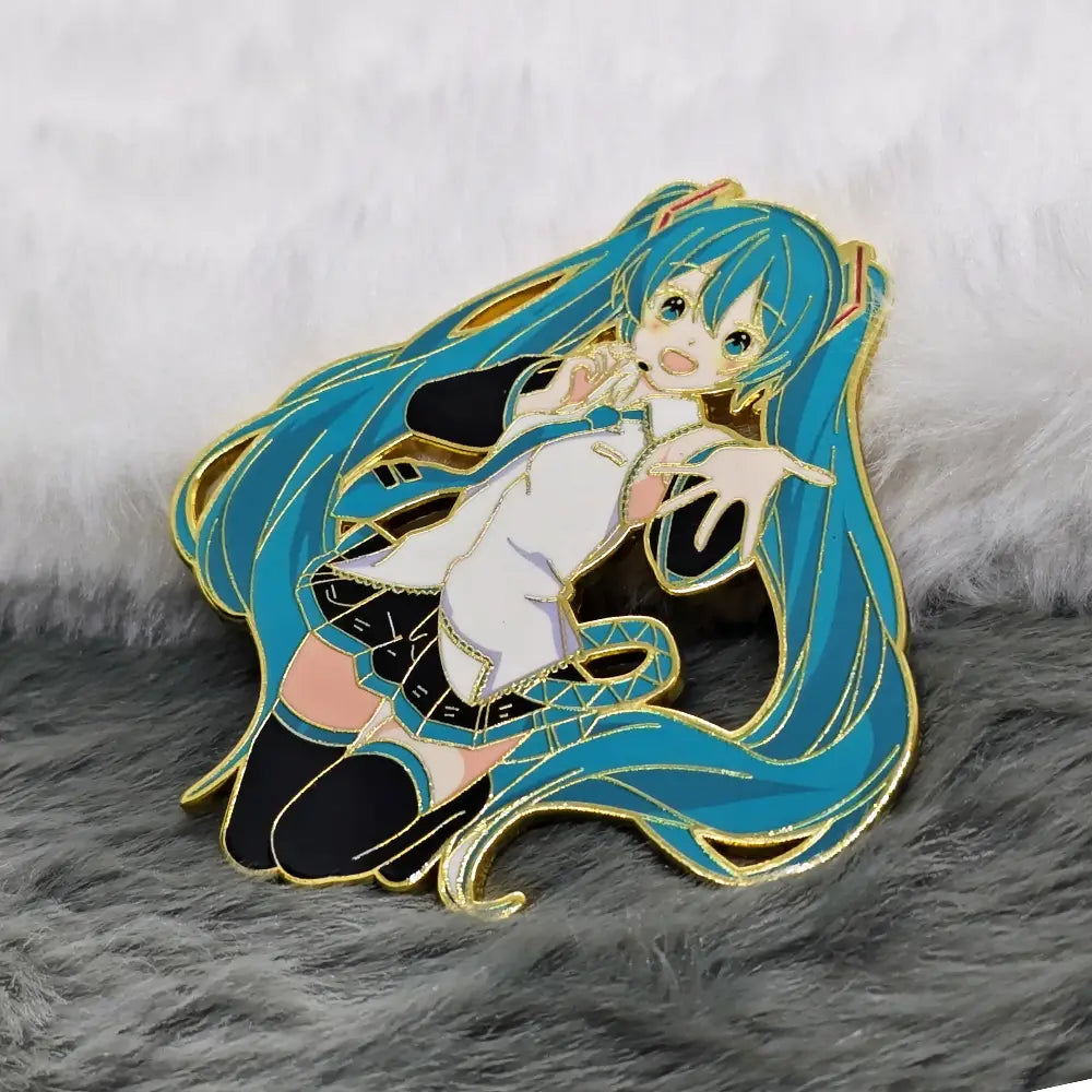 A vibrant blue-haired Hatsune Miku anime enamel pin with gold-trimmed details, featuring a white outfit, long flowing hair, and black thigh-high stockings.
