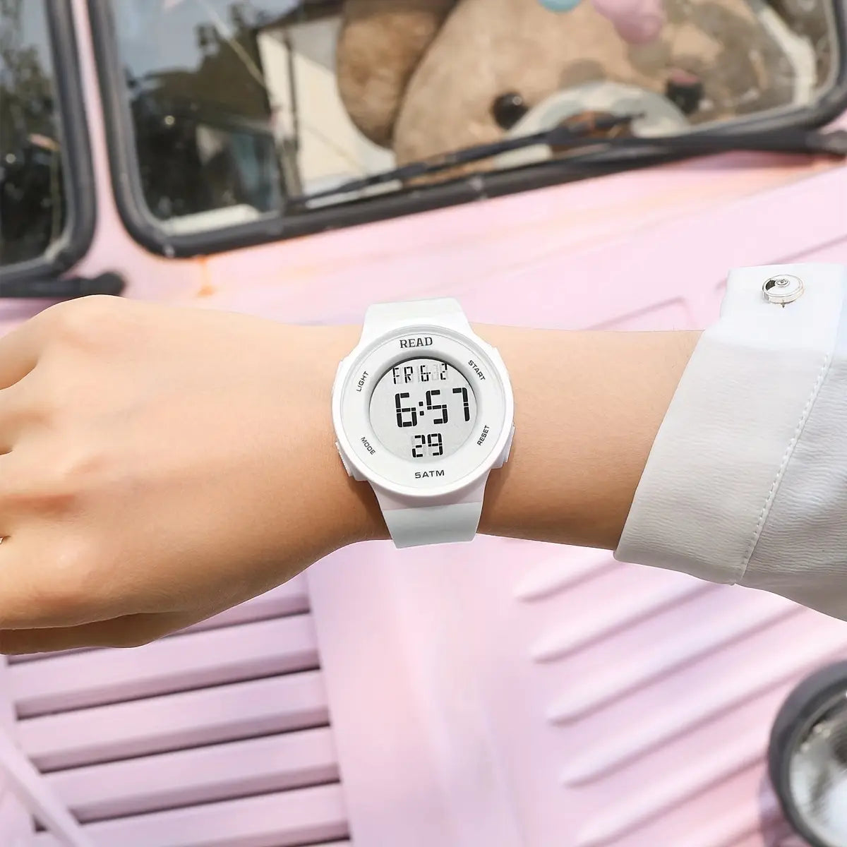 White LED digital sports watch for women featuring a matte finish and minimalist design with bold black numerals on the display, suitable for waterproof fitness use.